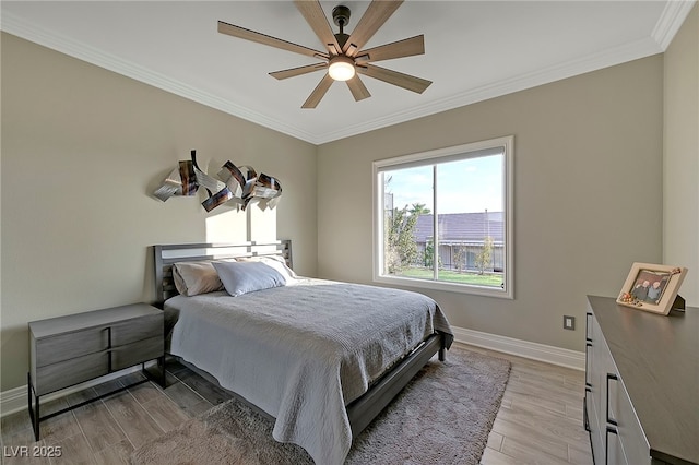 bedroom featuring crown molding, ceiling fan, and light wood-type flooring