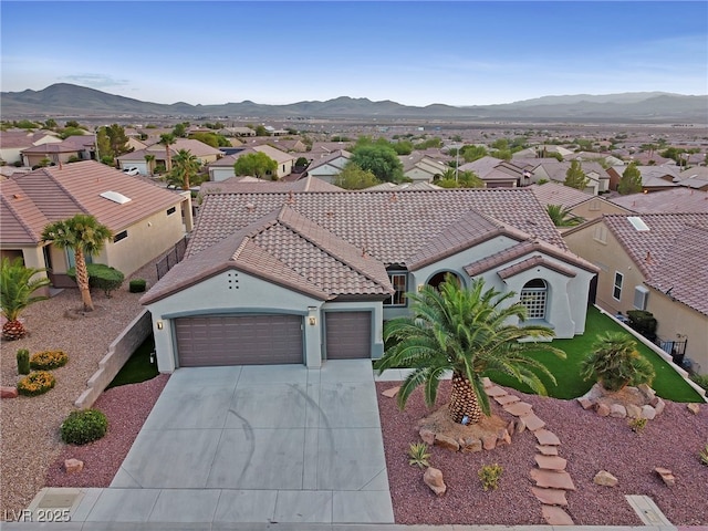 birds eye view of property featuring a mountain view