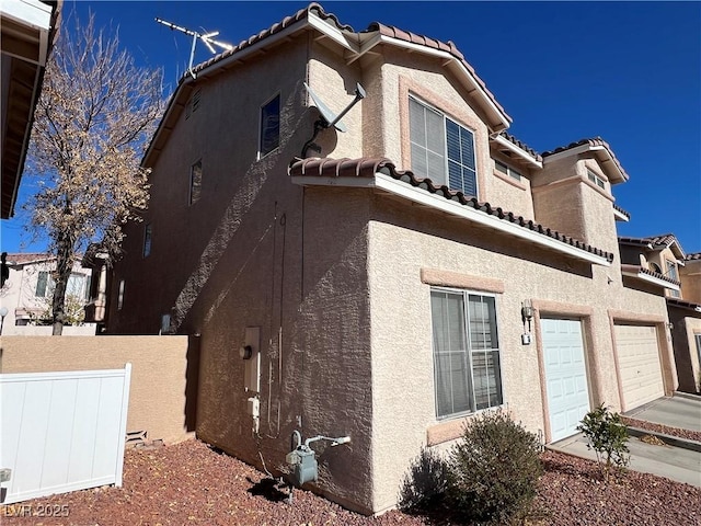 view of side of property featuring a garage