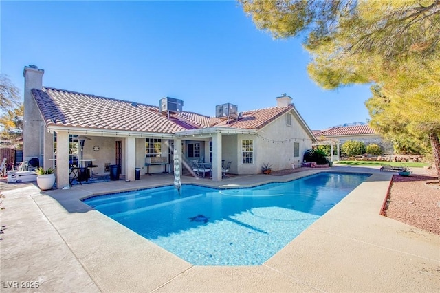 view of swimming pool featuring a patio and central air condition unit