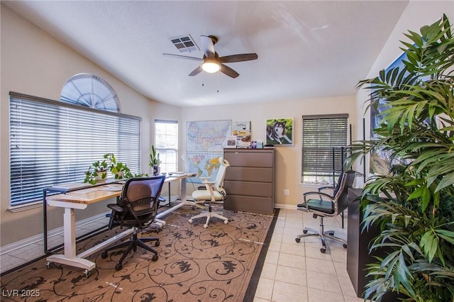 home office featuring light tile patterned flooring and ceiling fan