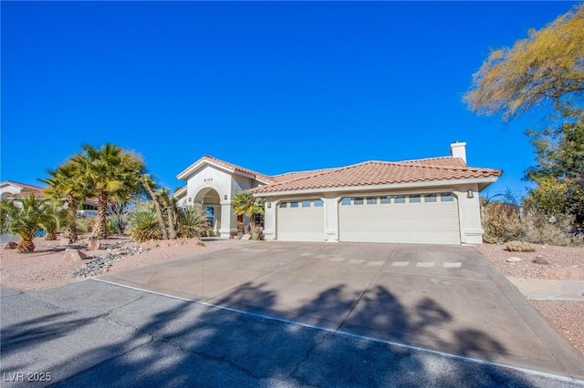 mediterranean / spanish-style house featuring a garage