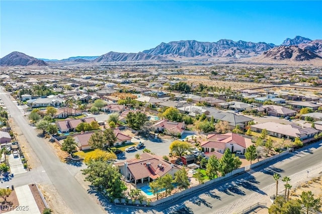 birds eye view of property featuring a mountain view