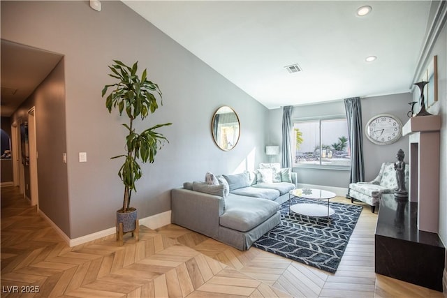 living area with recessed lighting, visible vents, vaulted ceiling, and baseboards