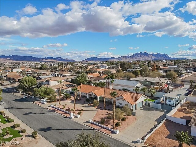 birds eye view of property featuring a mountain view and a residential view