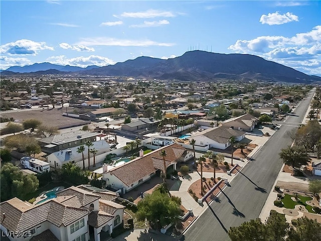 drone / aerial view featuring a residential view and a mountain view