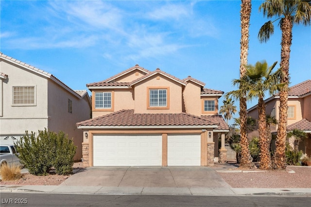 mediterranean / spanish-style house featuring a garage