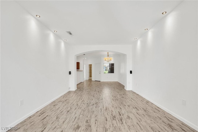 unfurnished living room with light wood-type flooring