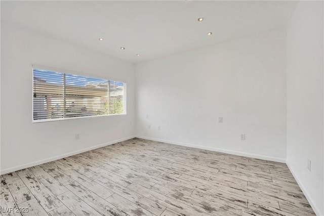 spare room featuring light hardwood / wood-style flooring