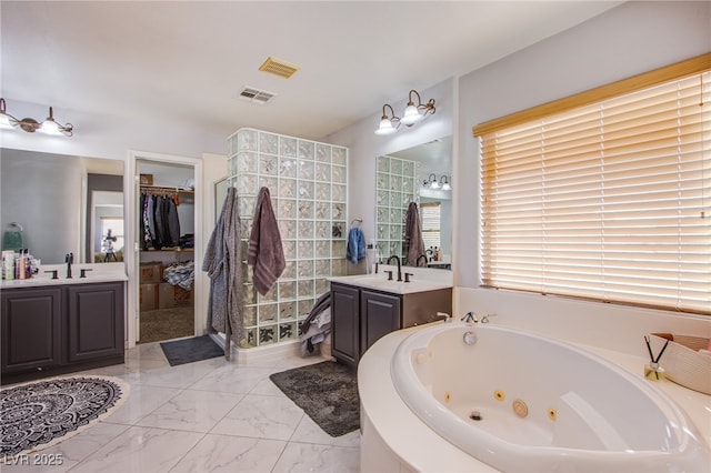 bathroom with vanity and a bathtub