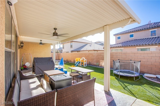 view of patio with an outdoor living space, a playground, and a trampoline