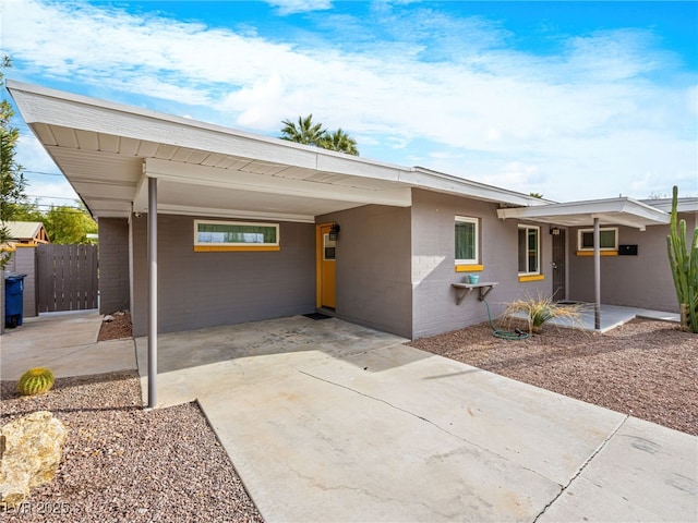 single story home featuring a carport