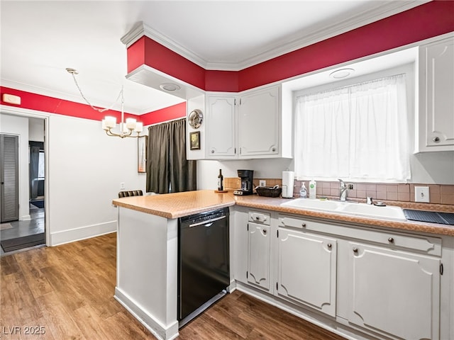 kitchen with hardwood / wood-style flooring, white cabinetry, black dishwasher, and sink