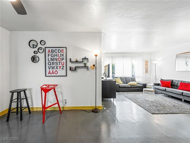 living room with concrete flooring and a textured ceiling