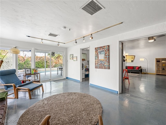 community lobby with washing machine and dryer