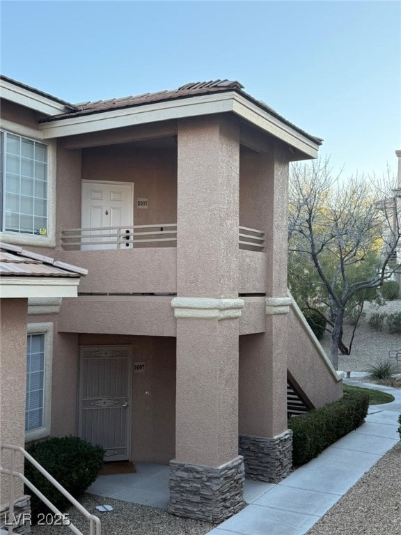 doorway to property with a balcony