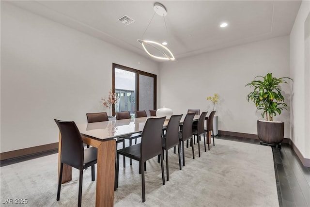 dining room with hardwood / wood-style flooring