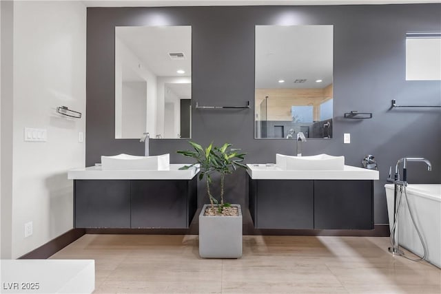 bathroom featuring vanity and a shower