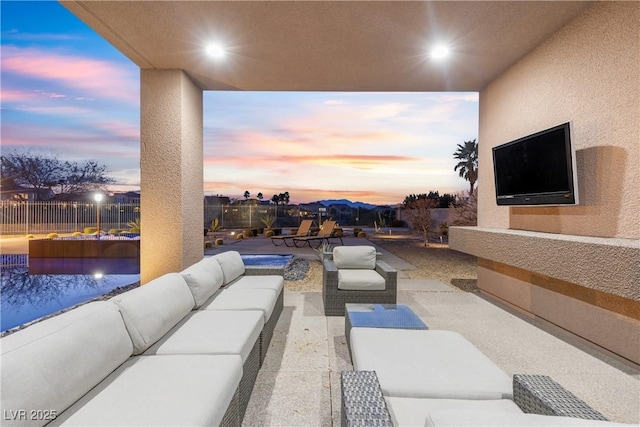 patio terrace at dusk with outdoor lounge area