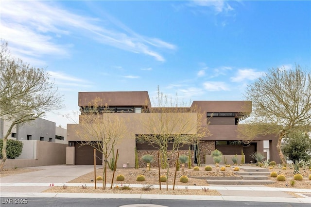 southwest-style home featuring a garage