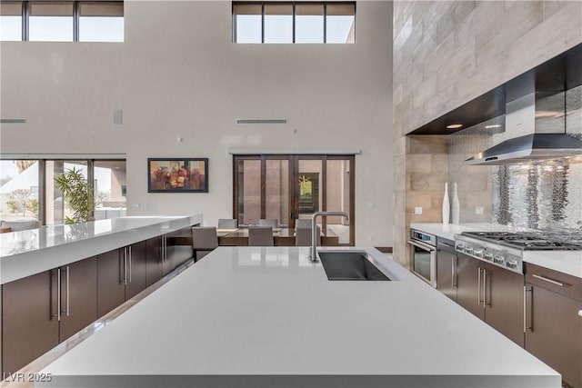 kitchen with stainless steel appliances, plenty of natural light, and sink