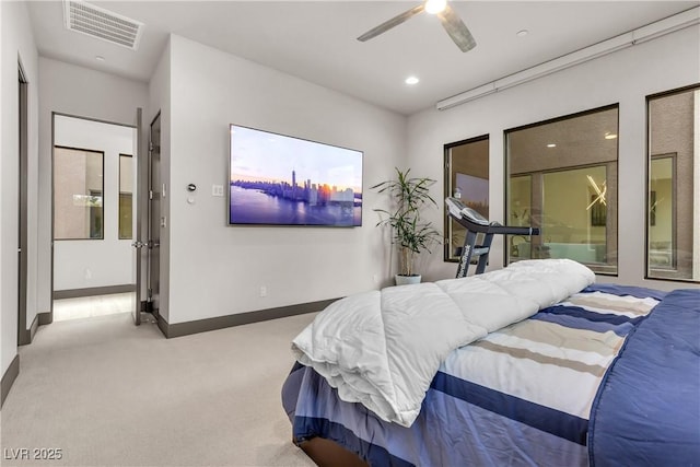 bedroom featuring light colored carpet and ceiling fan