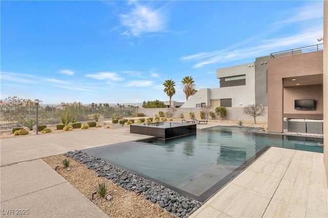 view of pool with a jacuzzi and a patio