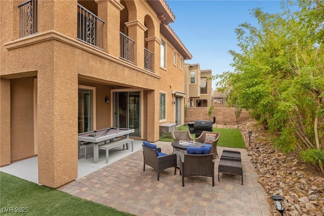 view of patio / terrace featuring area for grilling and an outdoor fire pit