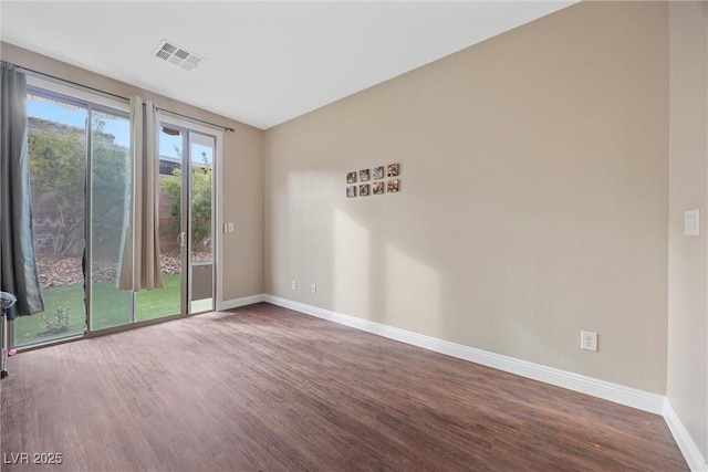 unfurnished room with hardwood / wood-style flooring