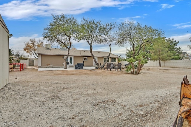 back of property with a patio and cooling unit