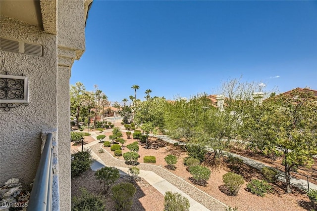 view of yard with a balcony