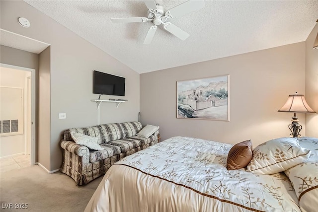 carpeted bedroom featuring vaulted ceiling, ceiling fan, and a textured ceiling