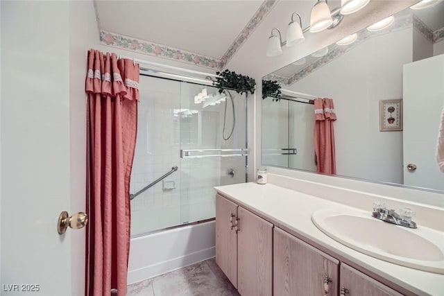 bathroom with vanity and shower / bath combination with glass door