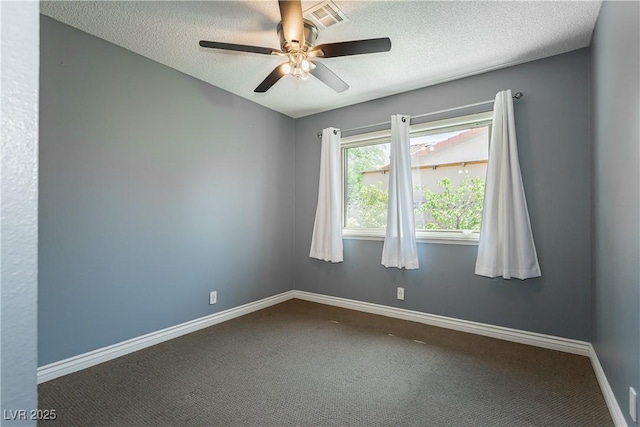 unfurnished room with ceiling fan, carpet, and a textured ceiling