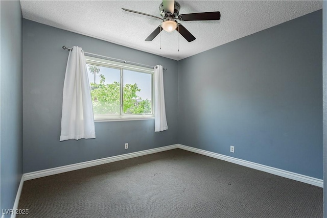 carpeted spare room with ceiling fan and a textured ceiling