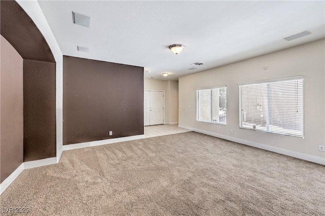 empty room with light colored carpet