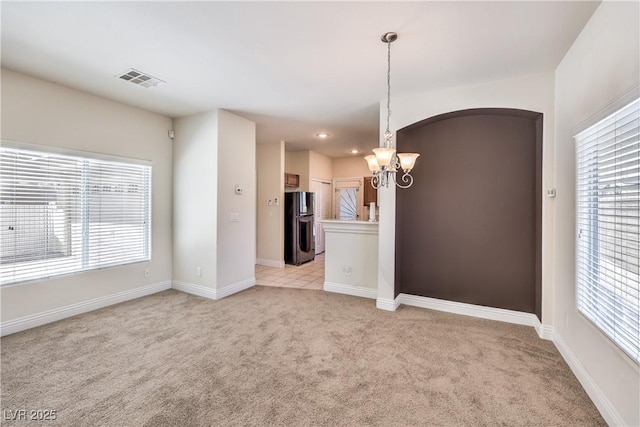 interior space with plenty of natural light and a notable chandelier