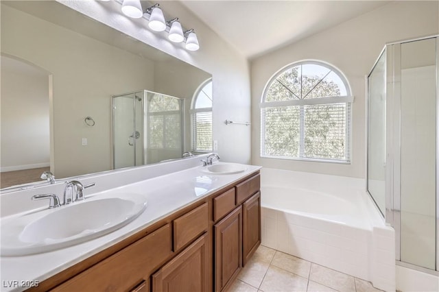 bathroom with lofted ceiling, vanity, independent shower and bath, and tile patterned flooring