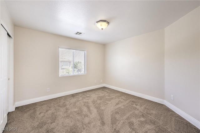 empty room featuring carpet floors