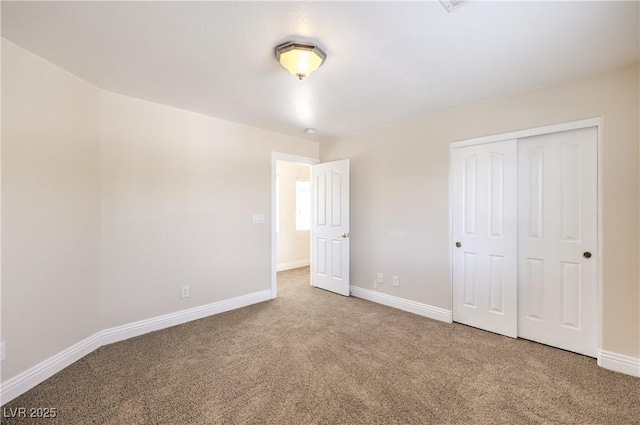 unfurnished bedroom featuring a closet and carpet flooring