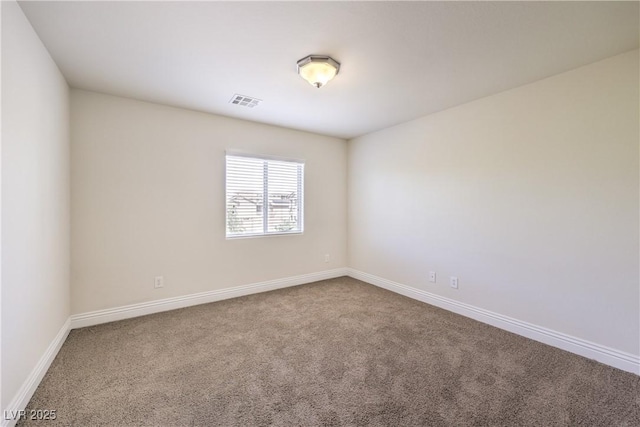 empty room featuring carpet flooring