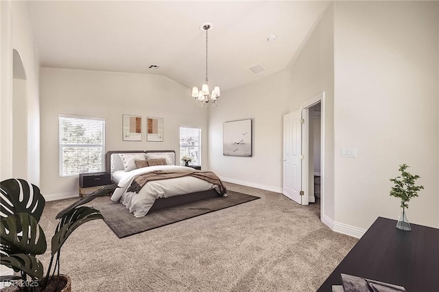 carpeted bedroom featuring vaulted ceiling and an inviting chandelier