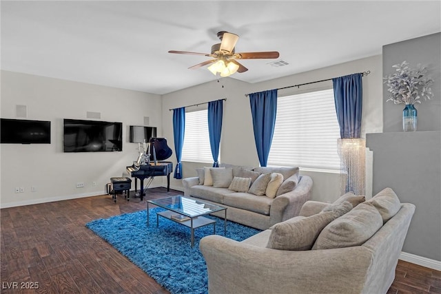 living room with dark hardwood / wood-style flooring and ceiling fan