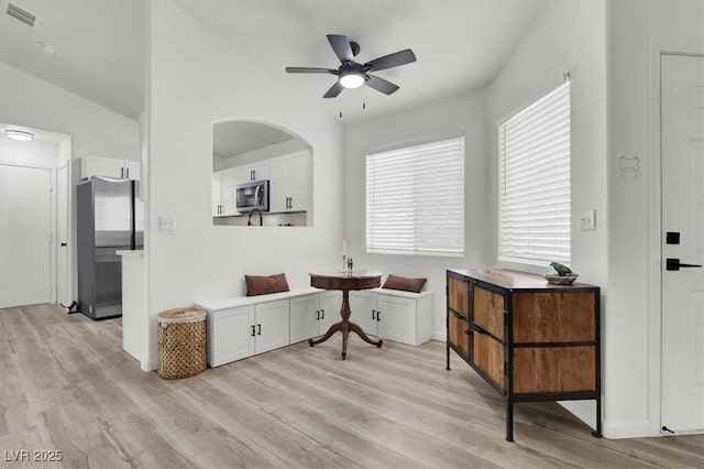 sitting room featuring ceiling fan and light wood-type flooring