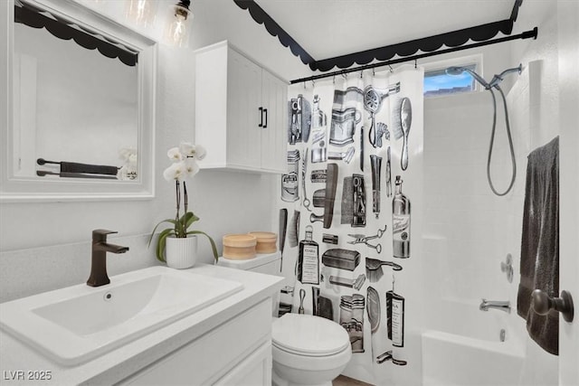 full bathroom featuring vanity, toilet, and shower / tub combo