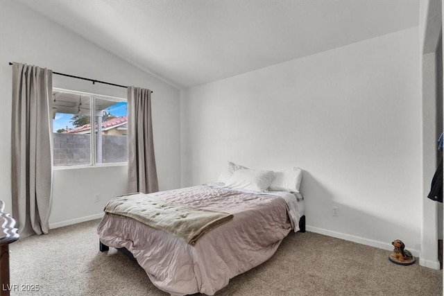 carpeted bedroom with vaulted ceiling