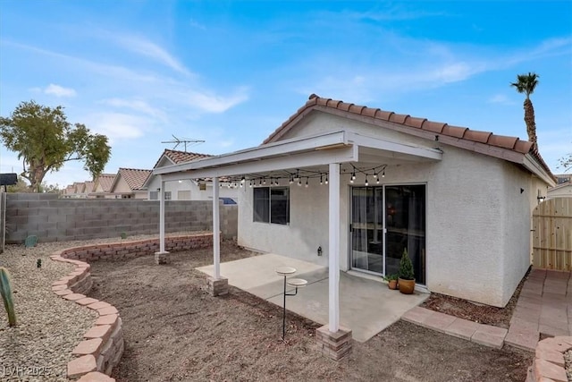 back of house with a patio