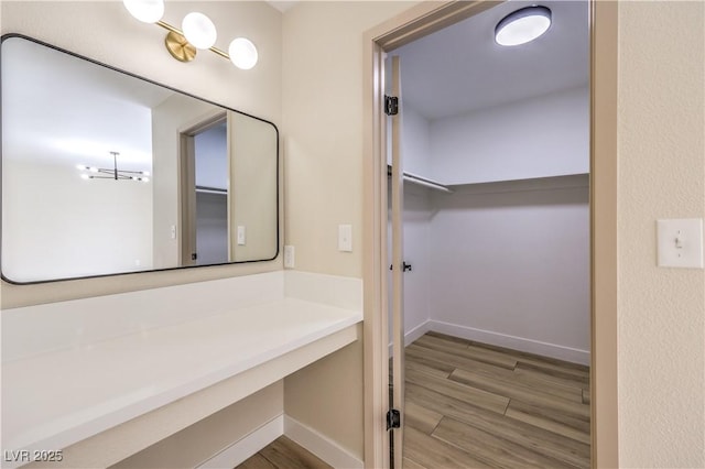 bathroom with hardwood / wood-style flooring