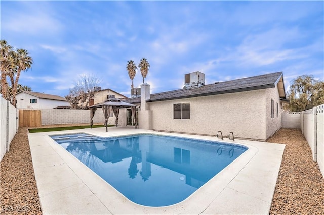 view of swimming pool with a gazebo and a patio