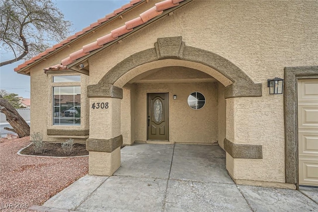 doorway to property featuring a patio